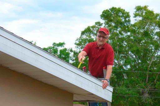 Man-assessing-roof Tampa, FL
