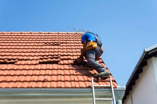 Man-working-on-tile-roof-repair Tampa, FL