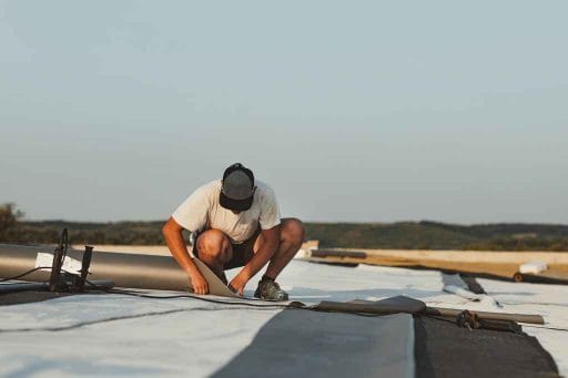 roofer-measuring-TPO-roof-material Tampa, FL